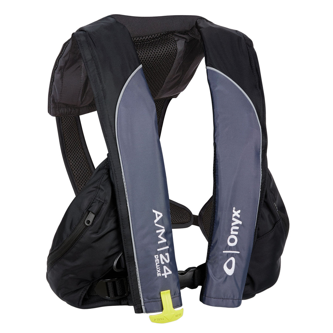 Onyx A/M-24 Deluxe Auto/Manual Life Jacket in black and navy blue.